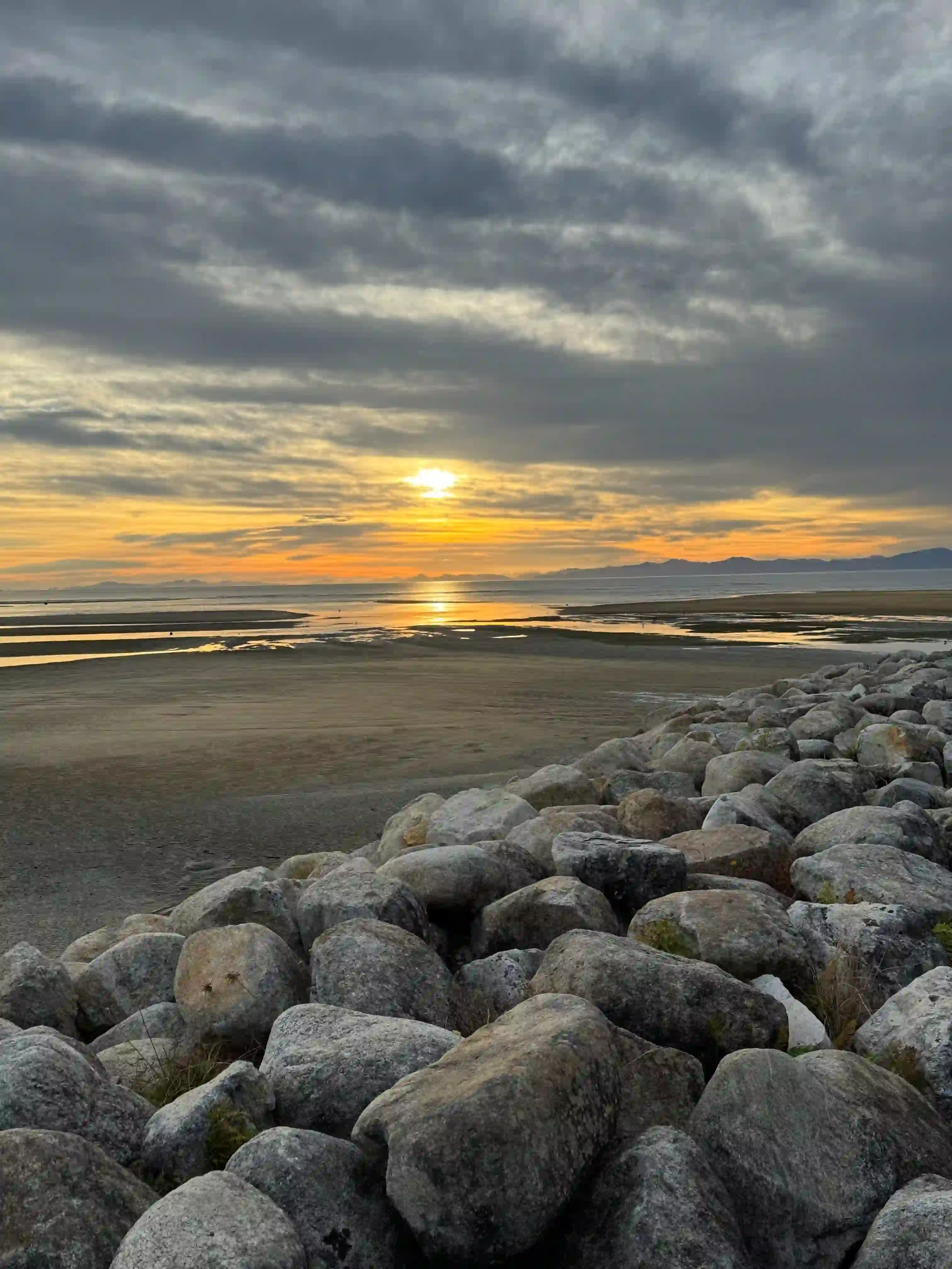 A photo of a sunrise and rocks